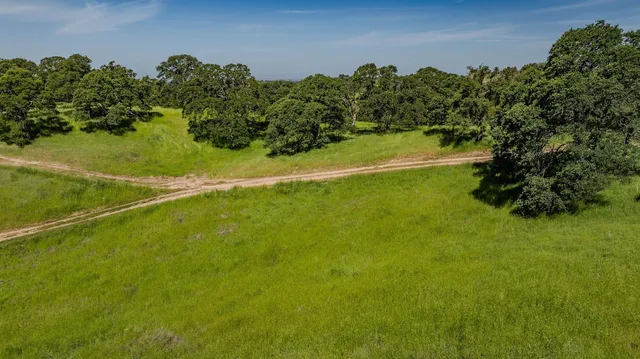 a view of a field with an outdoor space