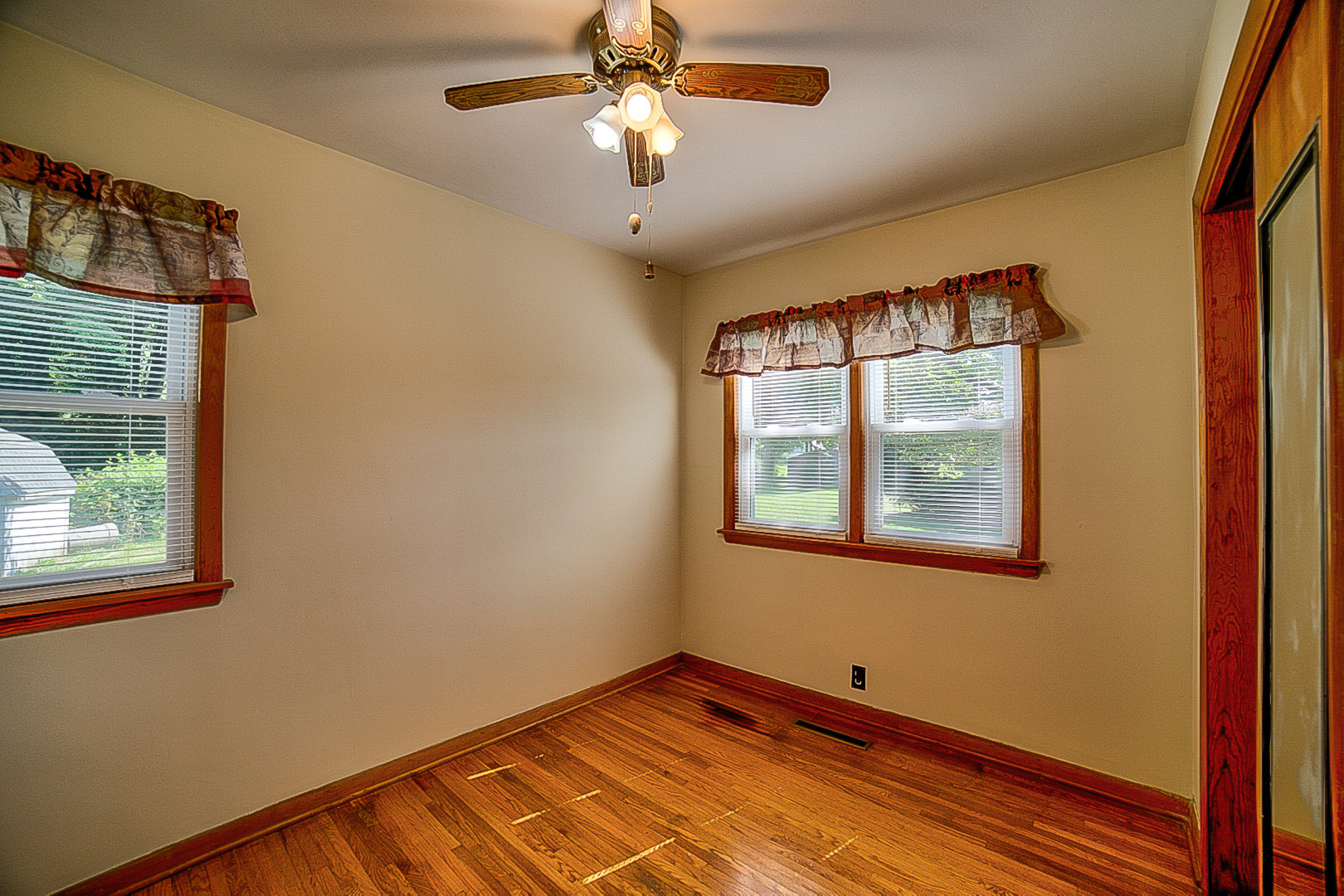 912 East Locust Street Watseka, IL 60970 - Photo 12 of 18 a view of empty room with window and ceiling fan