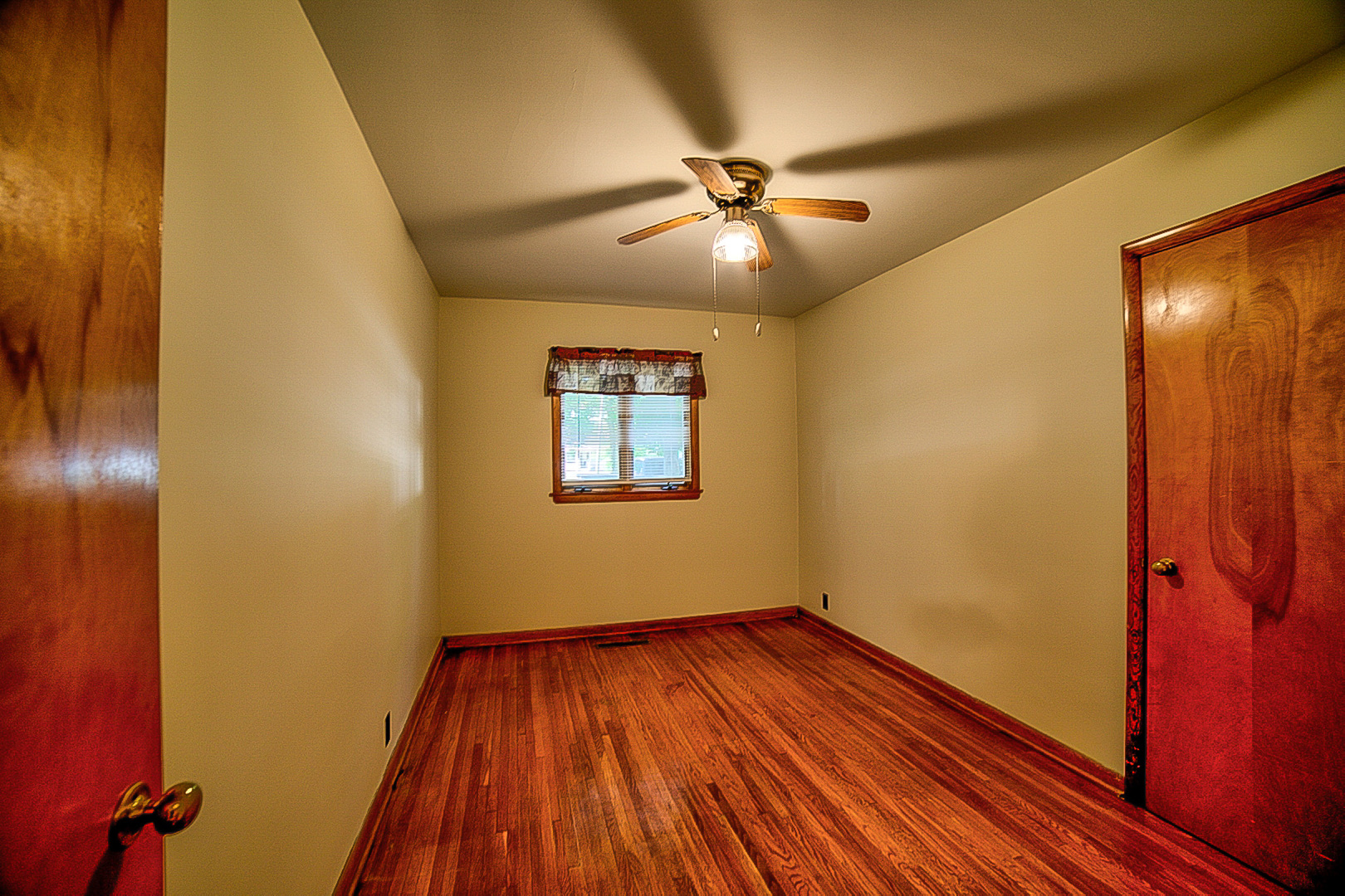 912 East Locust Street Watseka, IL 60970 - Photo 15 of 18 a view of empty room with wooden floor