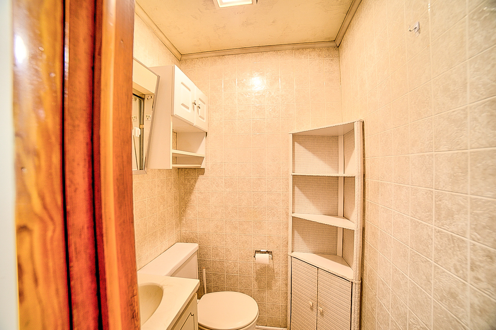 912 East Locust Street Watseka, IL 60970 - Photo 18 of 18 a bathroom with a granite countertop shower and a toilet