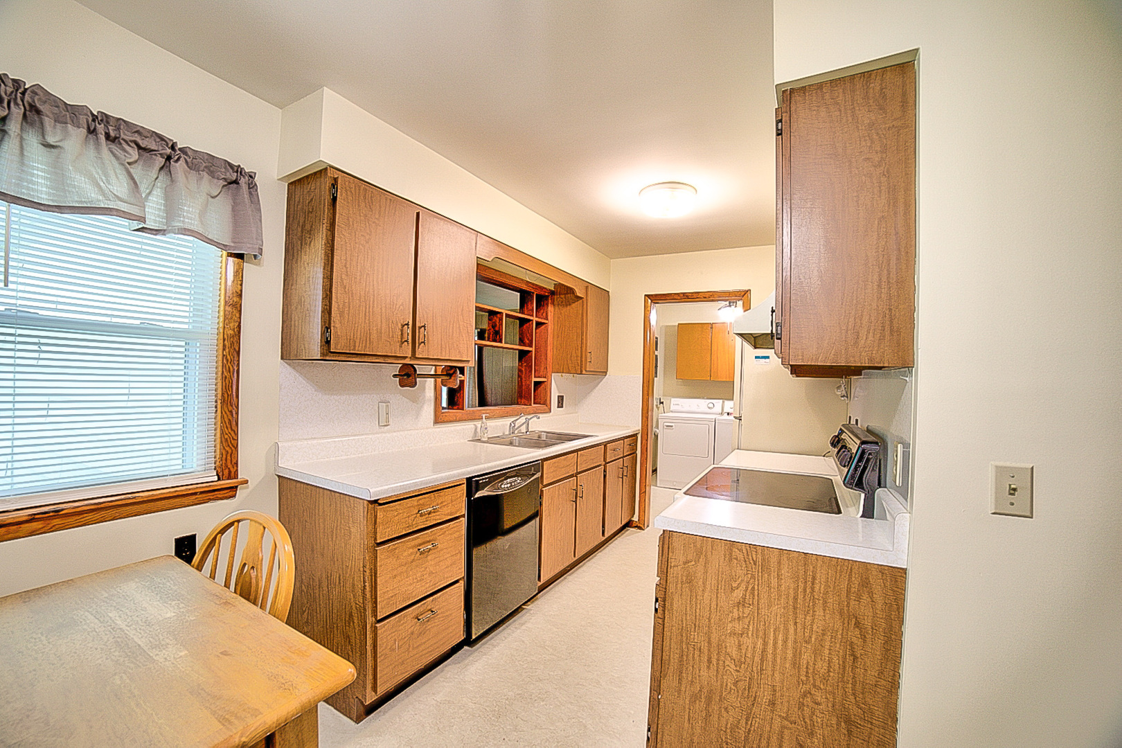 912 East Locust Street Watseka, IL 60970 - Photo 6 of 18 a kitchen with a sink stove and cabinets