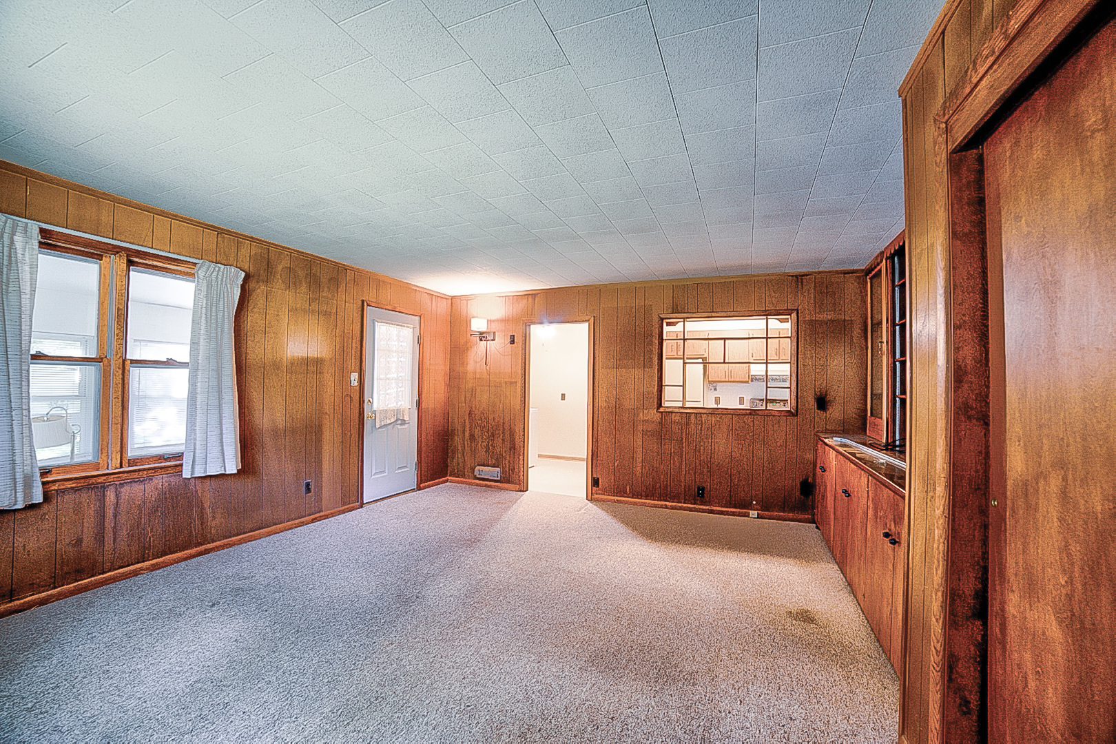 912 East Locust Street Watseka, IL 60970 - Photo 9 of 18 a view of an empty room with a window and a bathroom