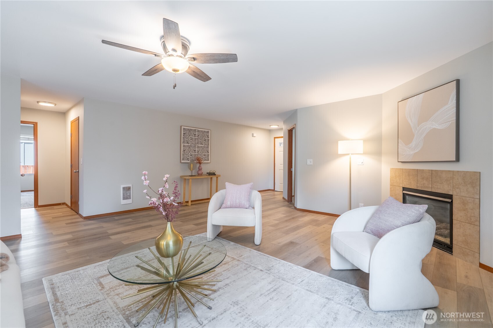 242 Riggs Drive East Enumclaw, WA 98022 - Photo 9 of 40 a living room with furniture a fireplace and wooden floor