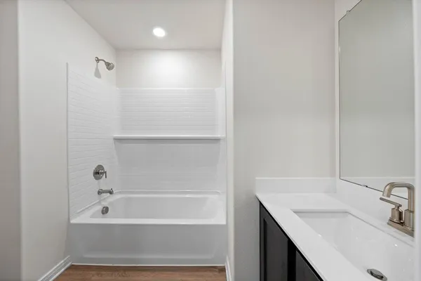 a bathroom with a sink and a bathtub