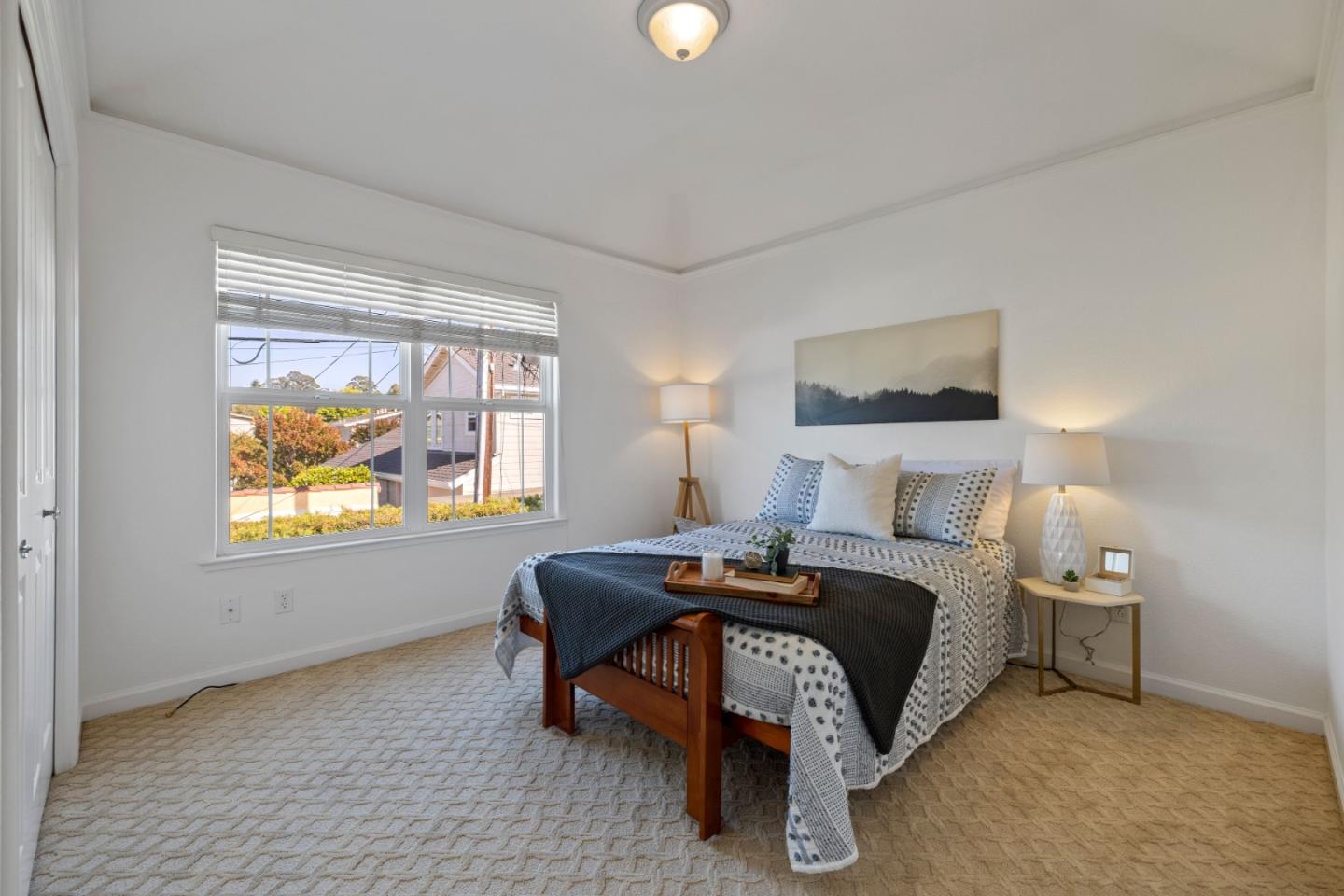 610 Gilroy Drive Capitola, CA 95010 - Photo 24 of 36 a bedroom with a bed and a lamp next to a window