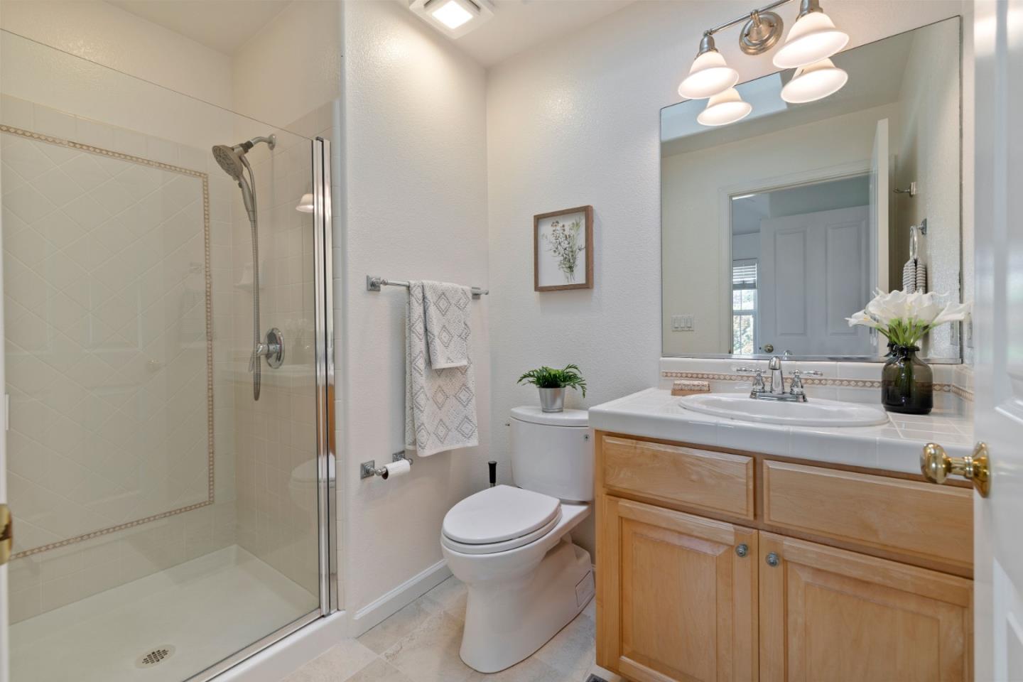 610 Gilroy Drive Capitola, CA 95010 - Photo 25 of 36 a bathroom with a toilet sink vanity granite and shower