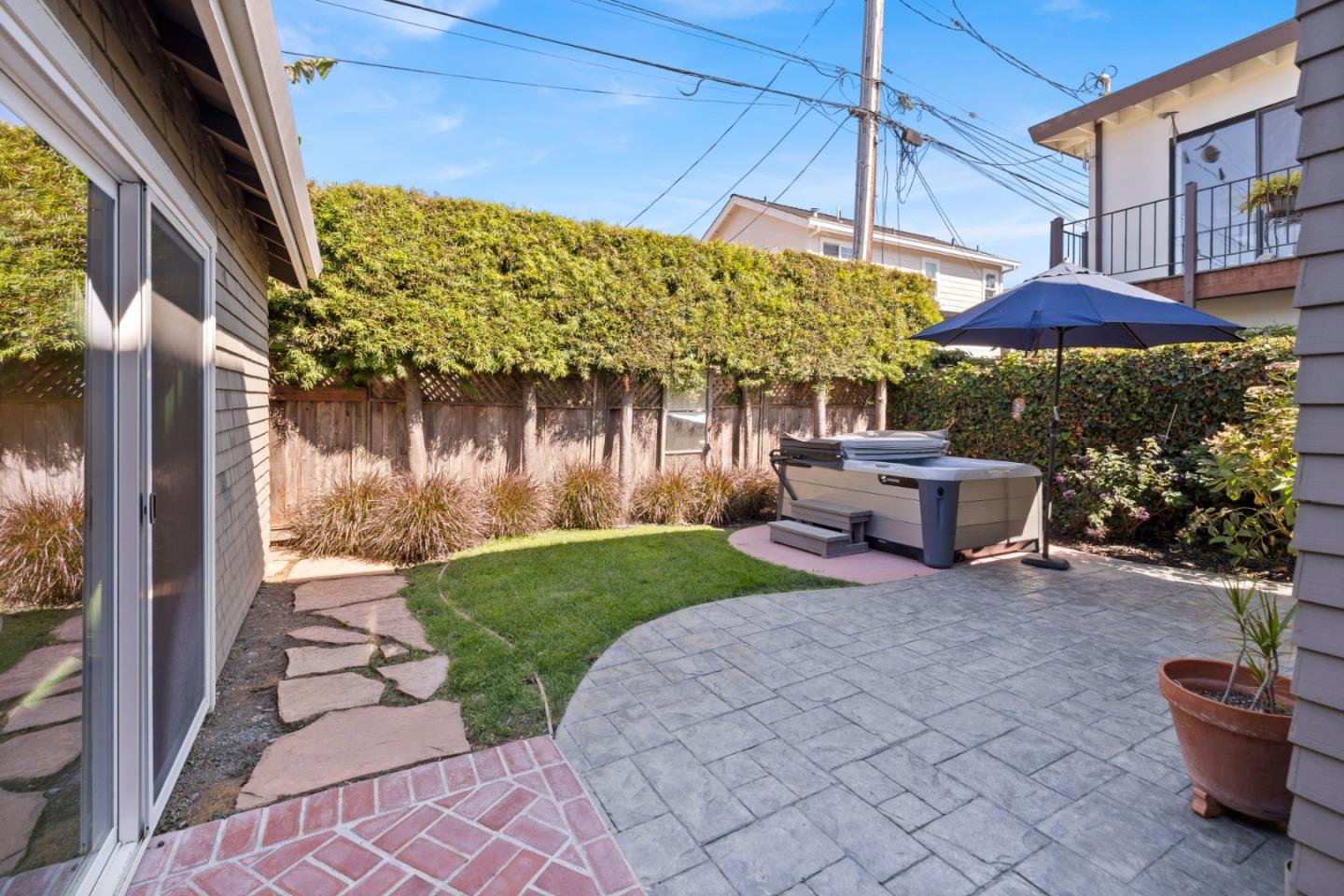 610 Gilroy Drive Capitola, CA 95010 - Photo 29 of 36 a view of a patio with table and chairs under an umbrella