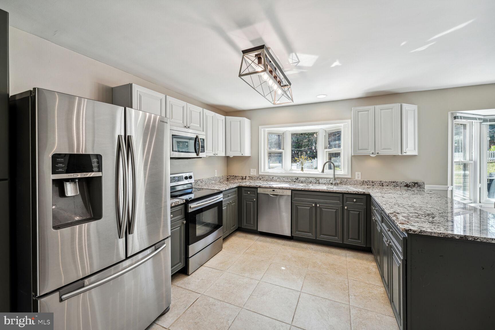 1816 Collingwood Road Alexandria, VA 22308 - Photo 10 of 29 Refinished cabinets and new light fixture.