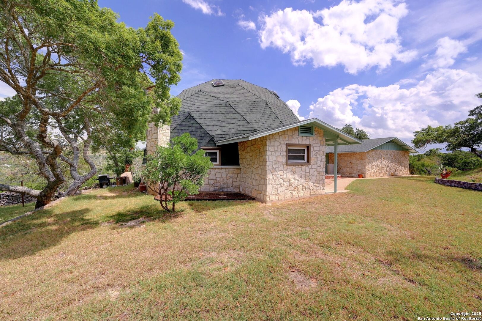 448 Red Rock Road Blanco, TX 78606 - Photo 8 of 52 a front view of a house with garden