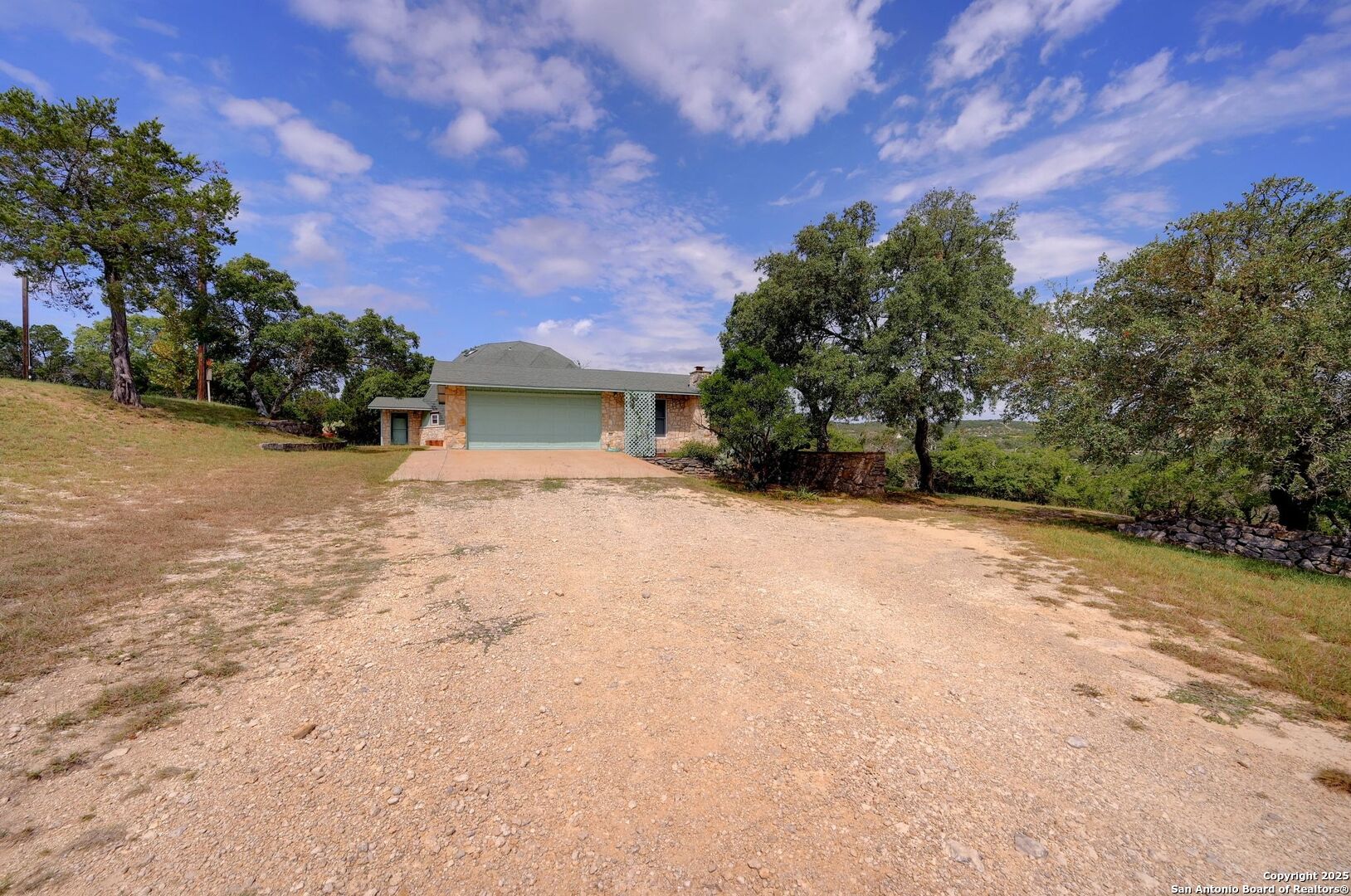 448 Red Rock Road Blanco, TX 78606 - Photo 10 of 52 a view of large tree with wooden fence