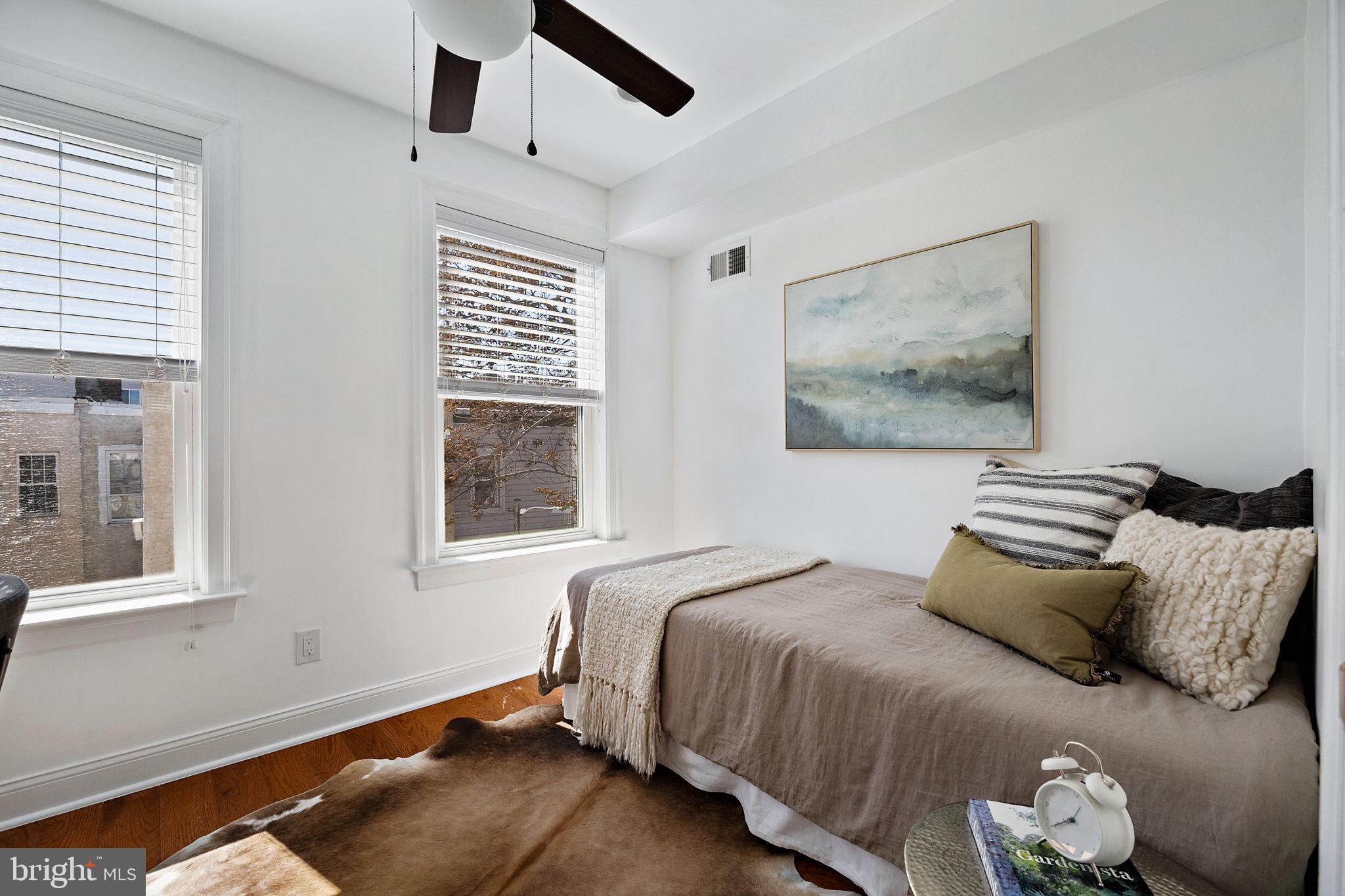 432 Mercy Street Philadelphia, PA 19148 - Photo 13 of 36 a bedroom with a bed and a window