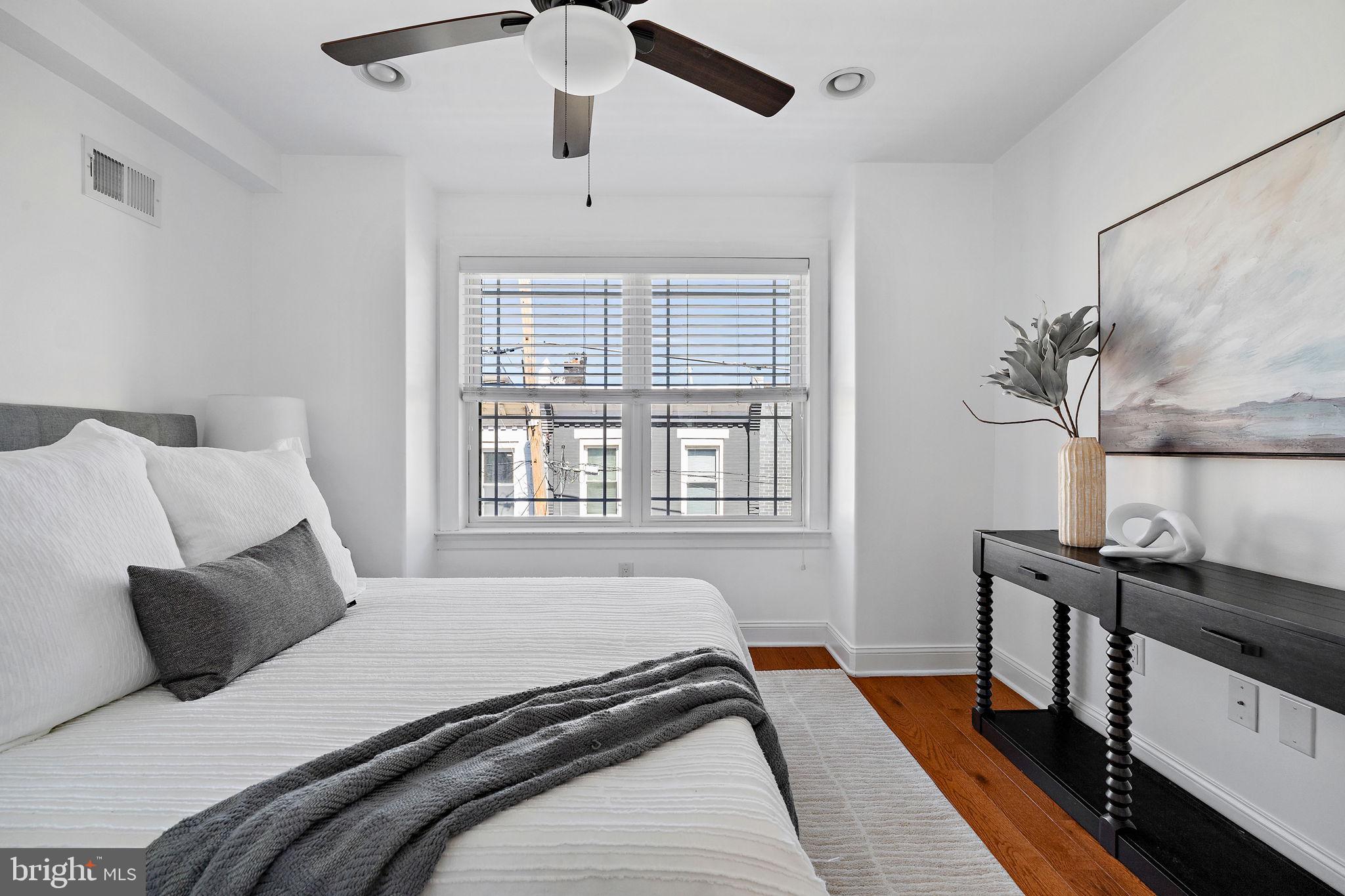 432 Mercy Street Philadelphia, PA 19148 - Photo 18 of 36 a bedroom with a bed and a window