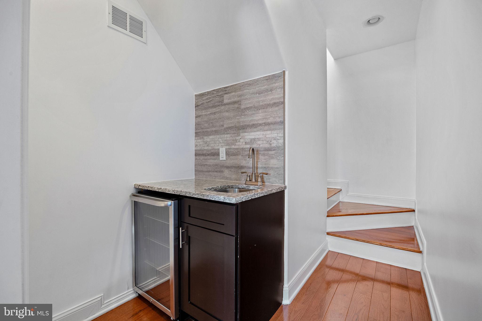 432 Mercy Street Philadelphia, PA 19148 - Photo 21 of 36 a kitchen with a sink and cabinets