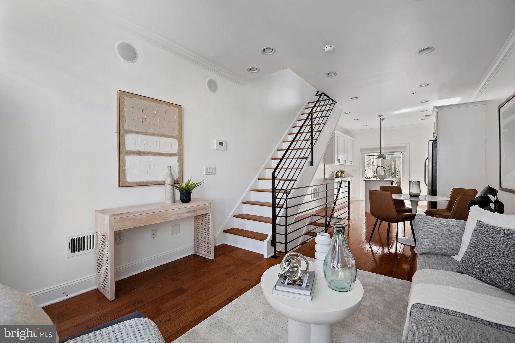 432 Mercy Street Philadelphia, PA 19148 - Photo 3 of 36 a living room with furniture and a wooden floor