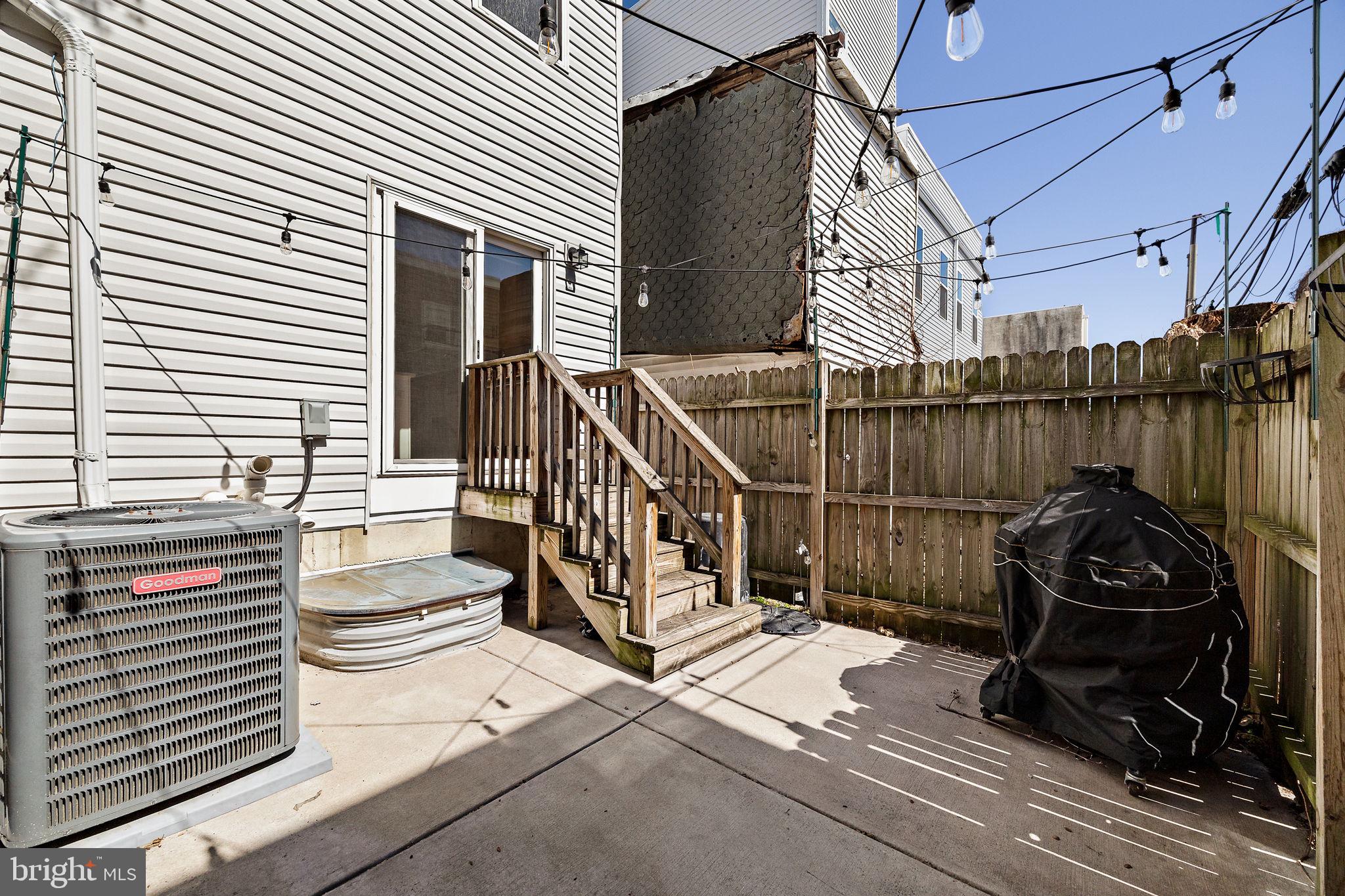 432 Mercy Street Philadelphia, PA 19148 - Photo 31 of 36 a view of a deck with couches next to a yard
