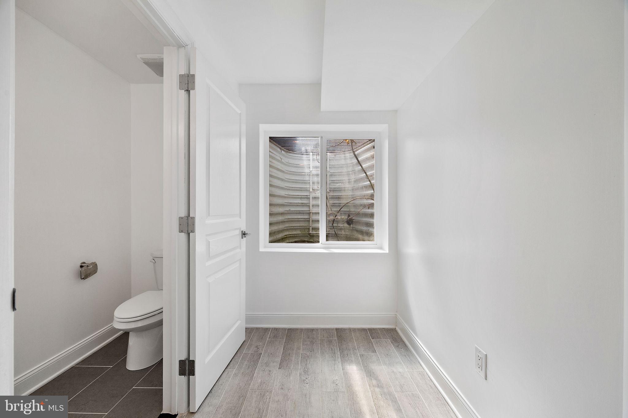 432 Mercy Street Philadelphia, PA 19148 - Photo 35 of 36 a view of bathroom with a toilet sink and a shower