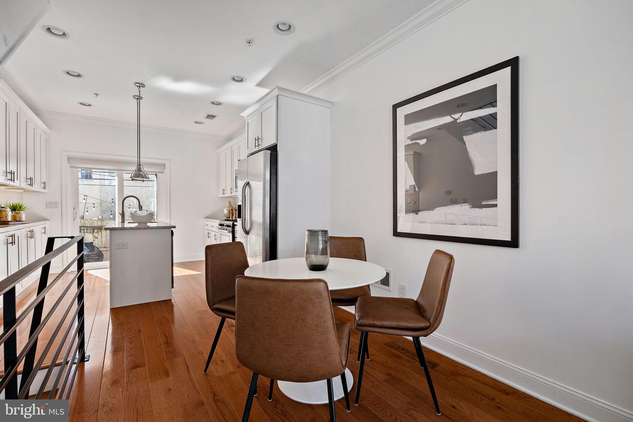 432 Mercy Street Philadelphia, PA 19148 - Photo 6 of 36 a dining room with furniture and wooden floor