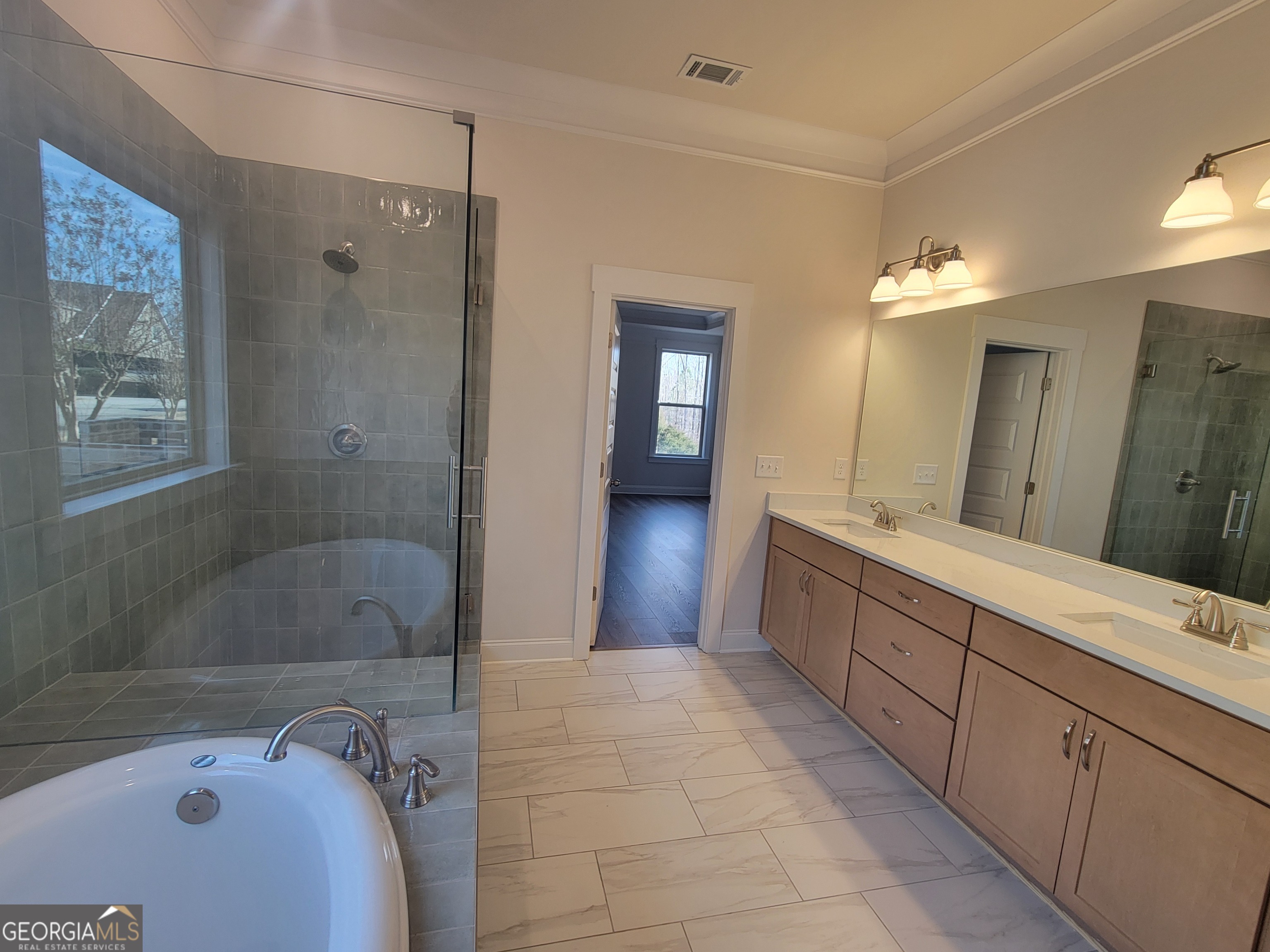 1960 Duncans Mill Lane, Unit 38N Jefferson, GA 30549 - Photo 15 of 26 a bathroom with a tub sink and mirror