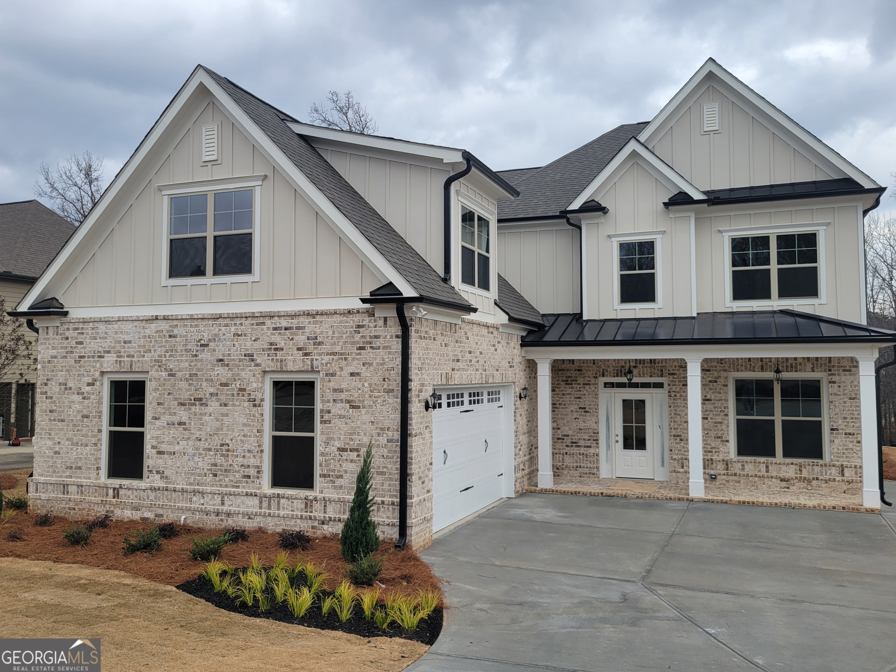 1960 Duncans Mill Lane, Unit 38N Jefferson, GA 30549 - Photo 2 of 26 a front view of a house with large windows