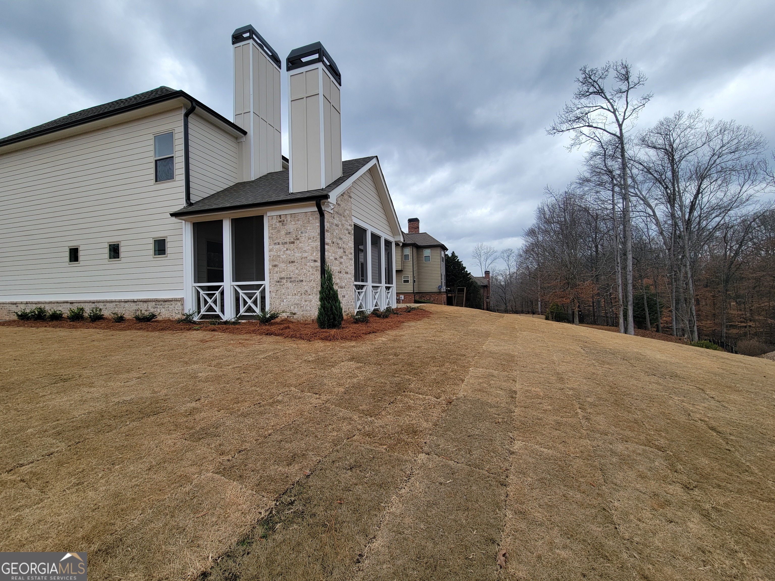 1960 Duncans Mill Lane, Unit 38N Jefferson, GA 30549 - Photo 26 of 26 a front view of a house with large trees
