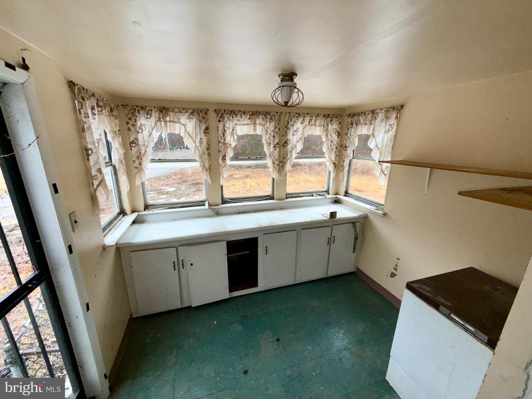 1053 Clayton Road Williamstown, NJ 08094 - Photo 18 of 24 a kitchen with a sink window and cabinets