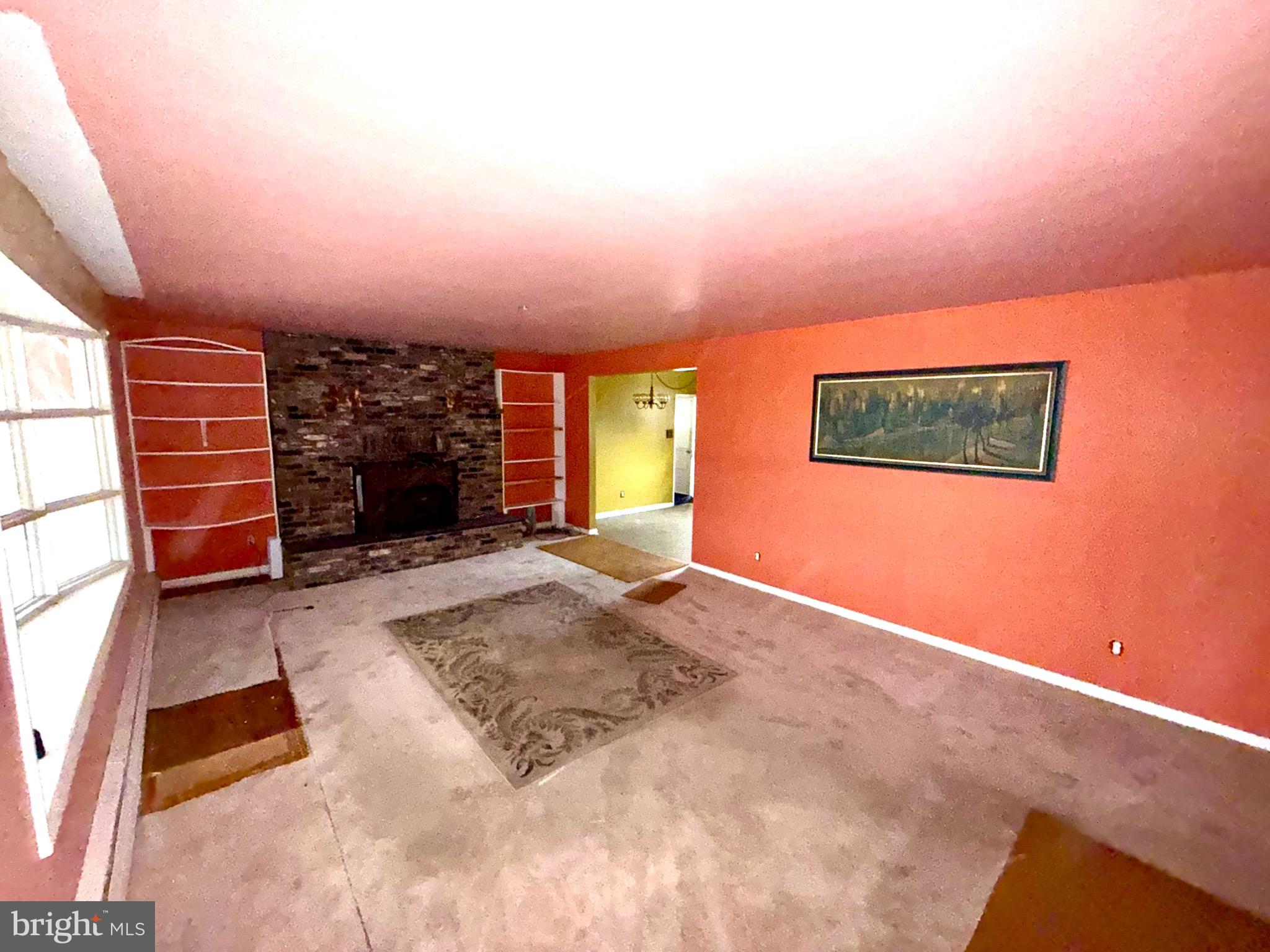 1053 Clayton Road Williamstown, NJ 08094 - Photo 2 of 24 a view of an empty room with a fireplace