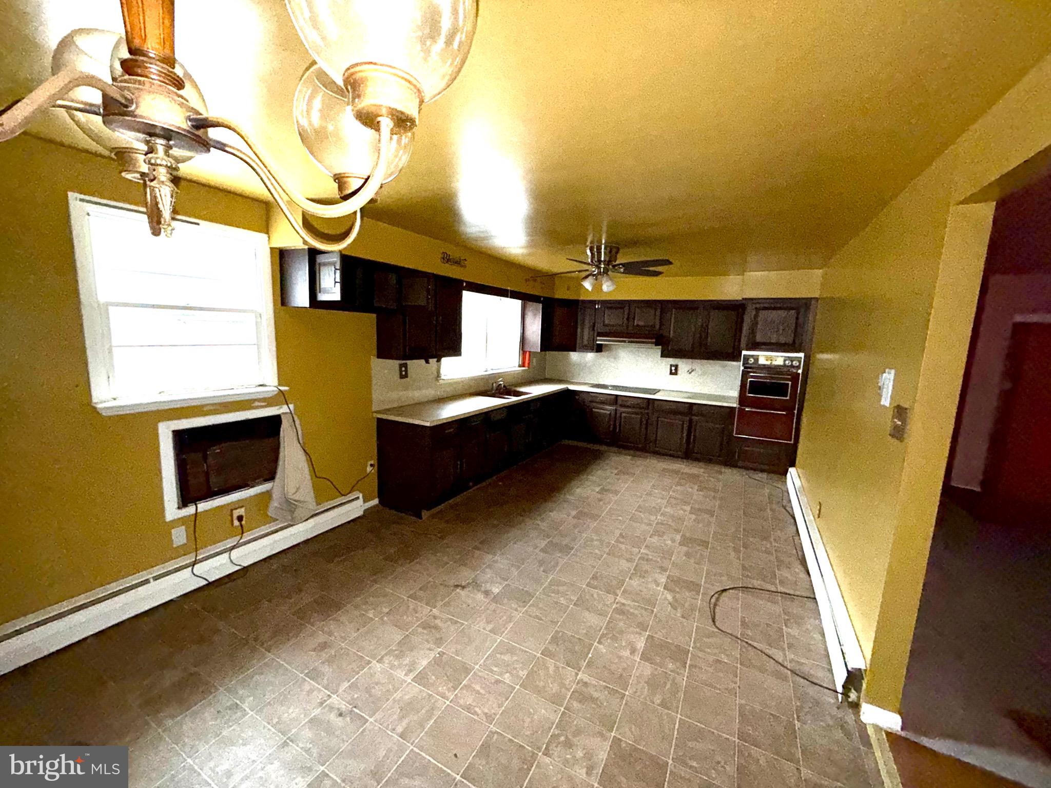 1053 Clayton Road Williamstown, NJ 08094 - Photo 4 of 24 a kitchen with a sink appliances and cabinets