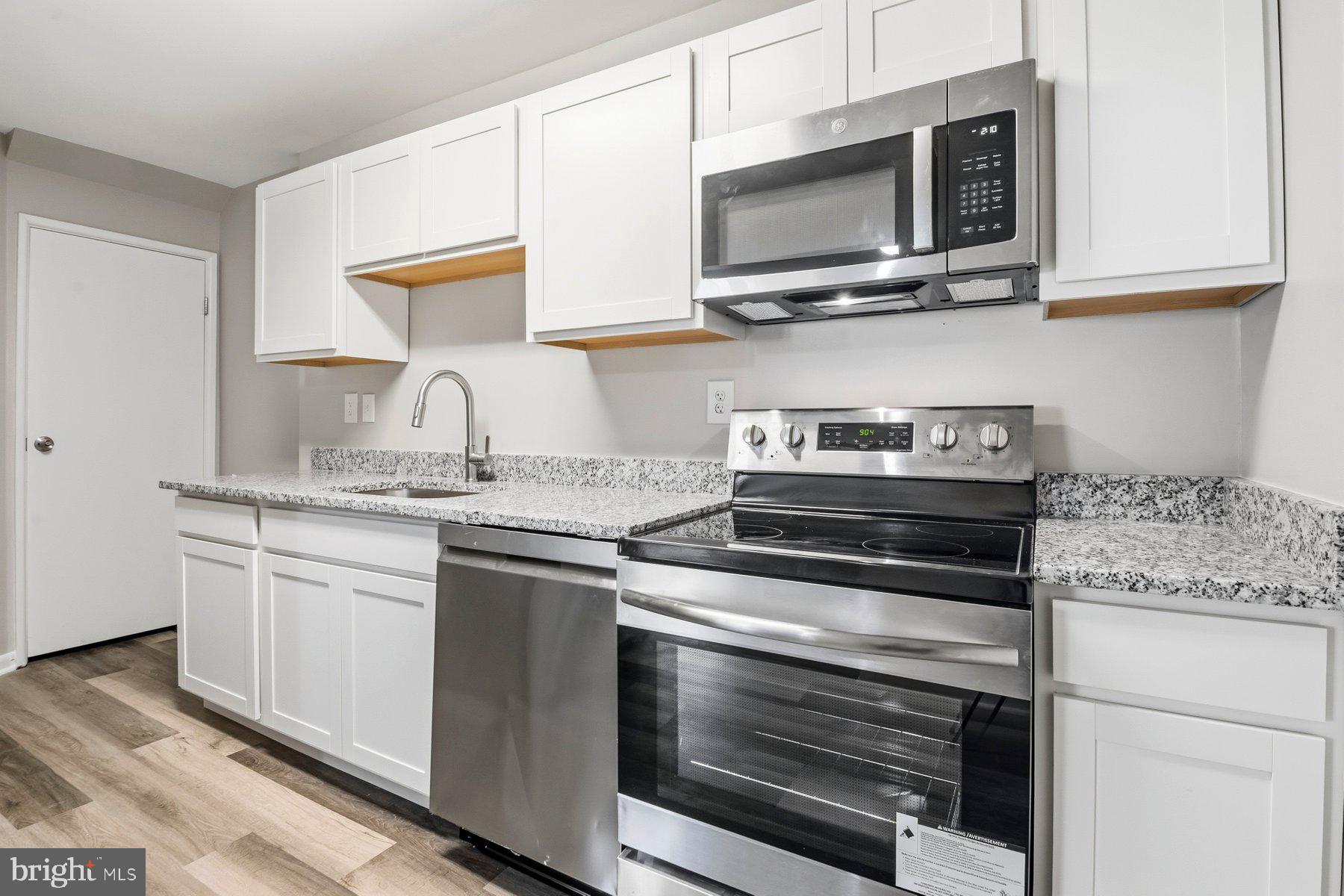 9080 Moonshine Hollow, Unit F Laurel, MD 20723 - Photo 8 of 24 Modern kitchen with sleek finishes.