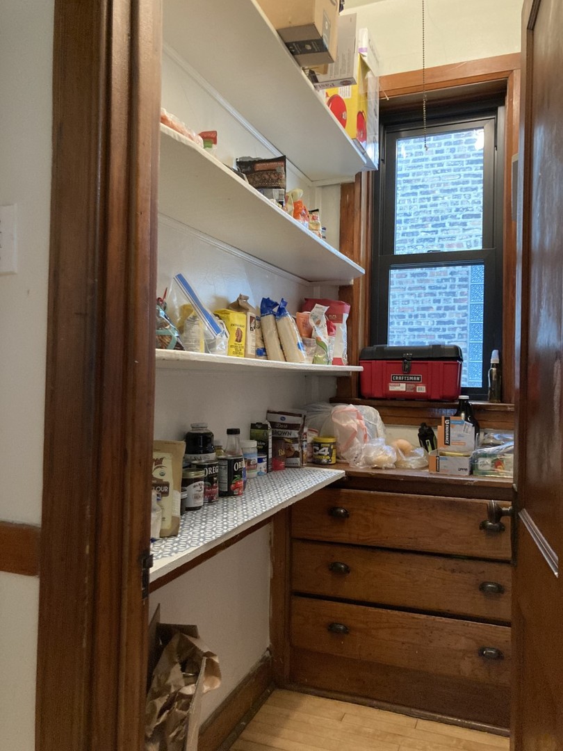 2223 West Iowa Street, Unit 2R Chicago, IL 60622 - Photo 12 of 20 a kitchen with a refrigerator and a window