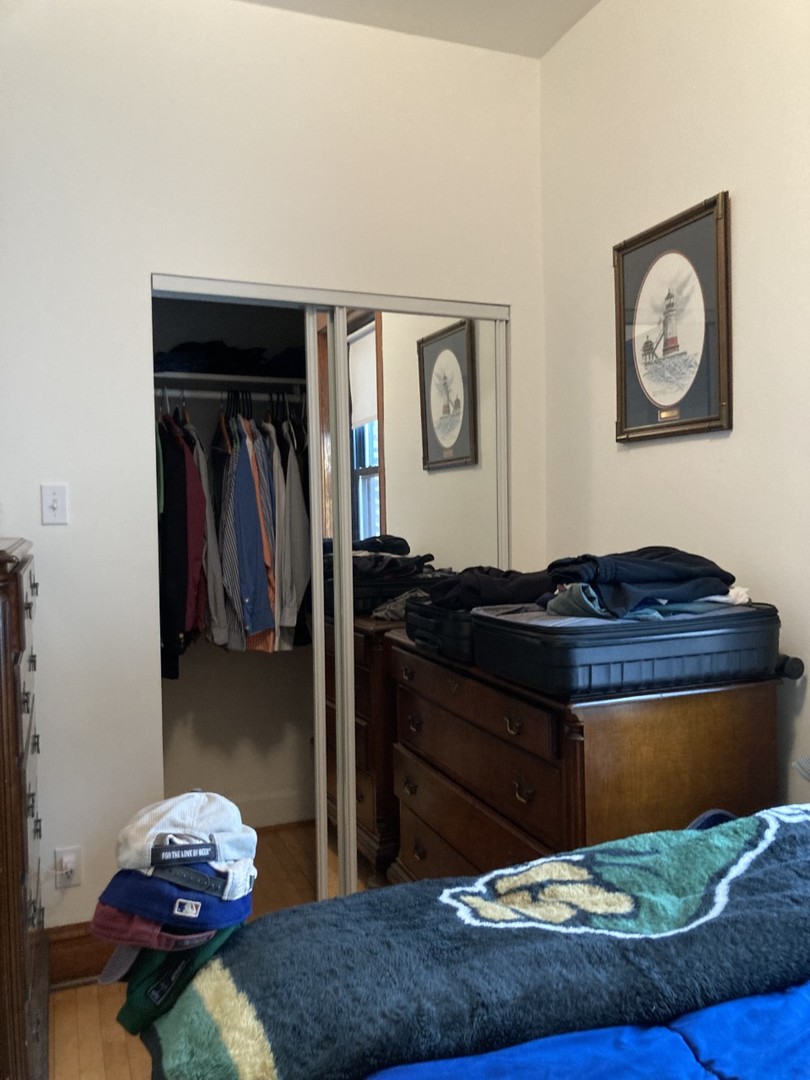 2223 West Iowa Street, Unit 2R Chicago, IL 60622 - Photo 18 of 20 a living room with a couch and painting on the wall