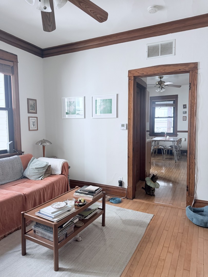 2223 West Iowa Street, Unit 2R Chicago, IL 60622 - Photo 5 of 20 a living room with furniture and a wooden floor