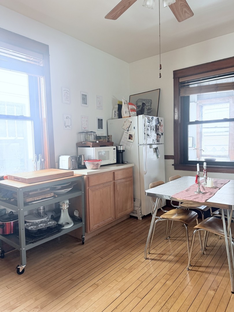 2223 West Iowa Street, Unit 2R Chicago, IL 60622 - Photo 8 of 20 a workspace with furniture window and wooden floor