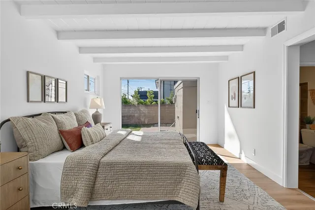 a bedroom with a bed and a couch