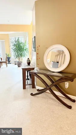 a living room with furniture and a lamp
