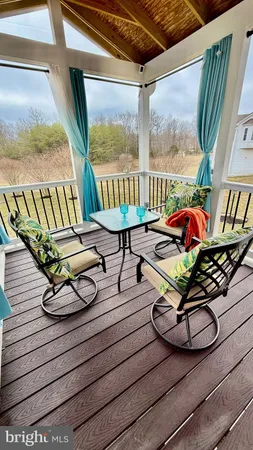 a livingroom with workspace and a window