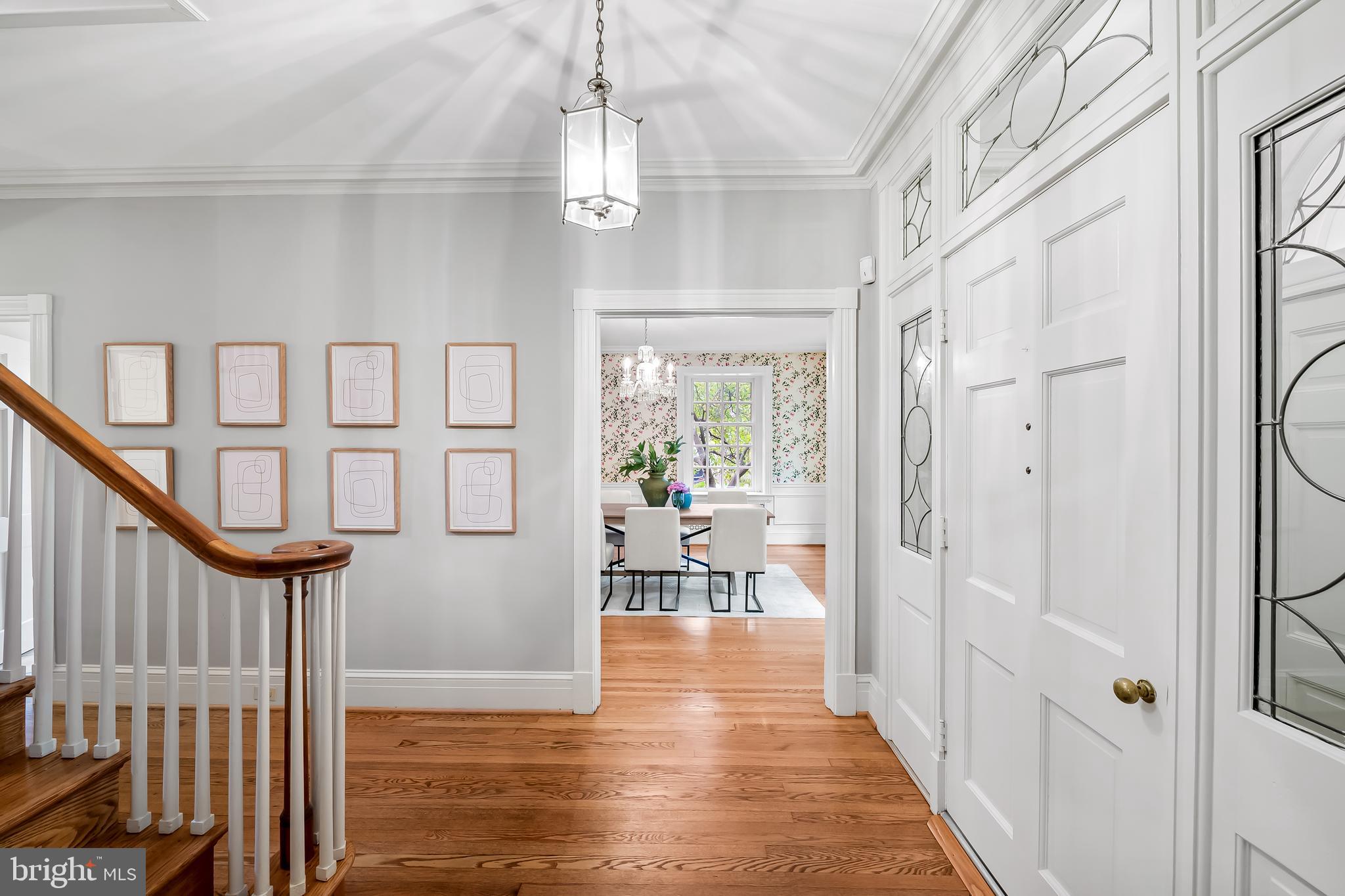 116 Enfield Road Baltimore, MD 21212 - Photo 5 of 71 a view of a hallway with wooden floor and dining room view