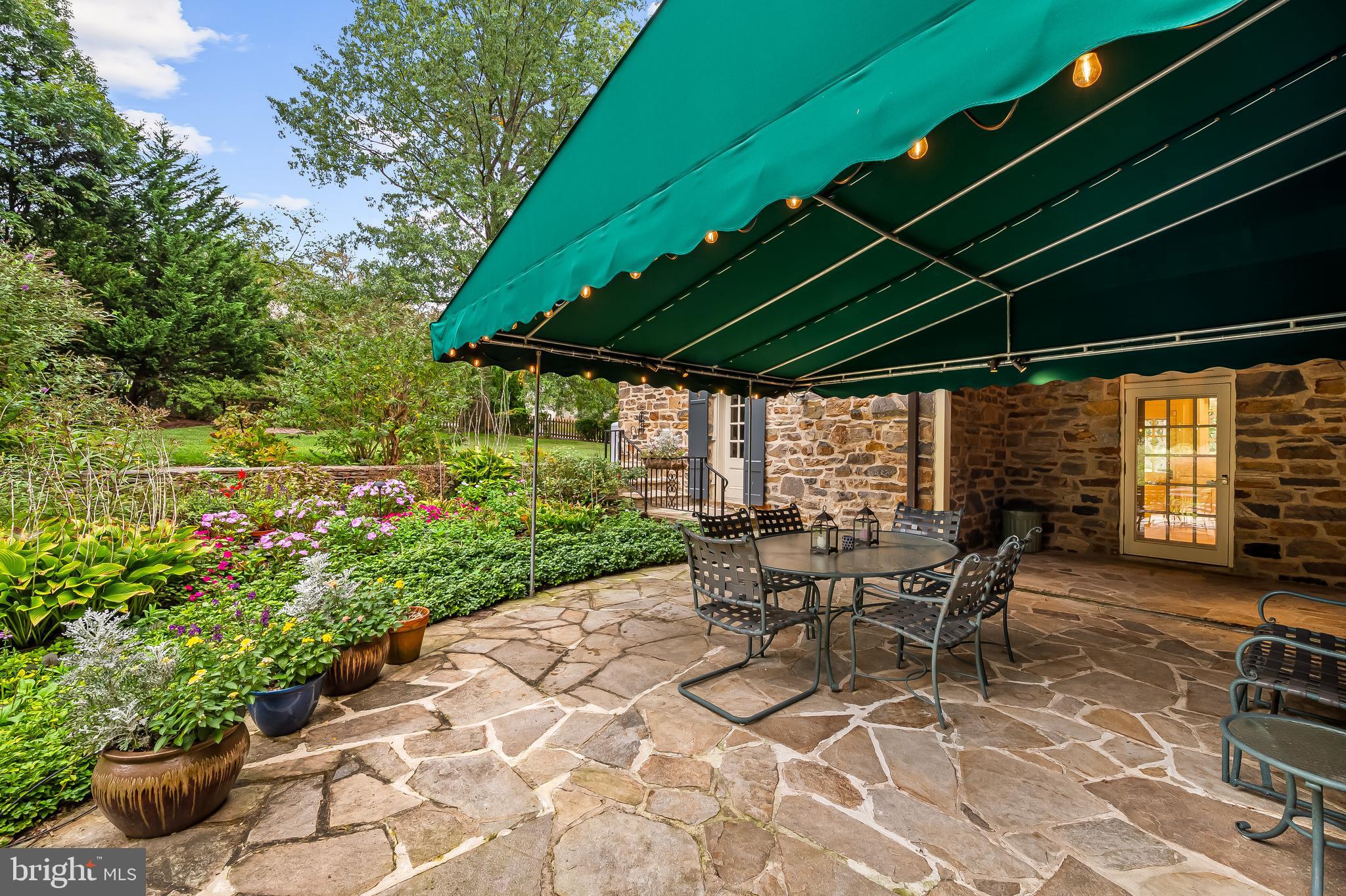 116 Enfield Road Baltimore, MD 21212 - Photo 71 of 71 a patio with table and chairs and potted plants