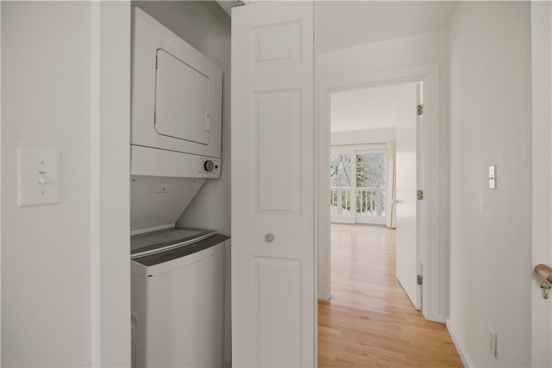 15 Hammersmith Road, Unit 30A Newport, RI 02840 - Photo 33 of 49 hallway, washer/dryer/ heading into primary bedroom w/ bath