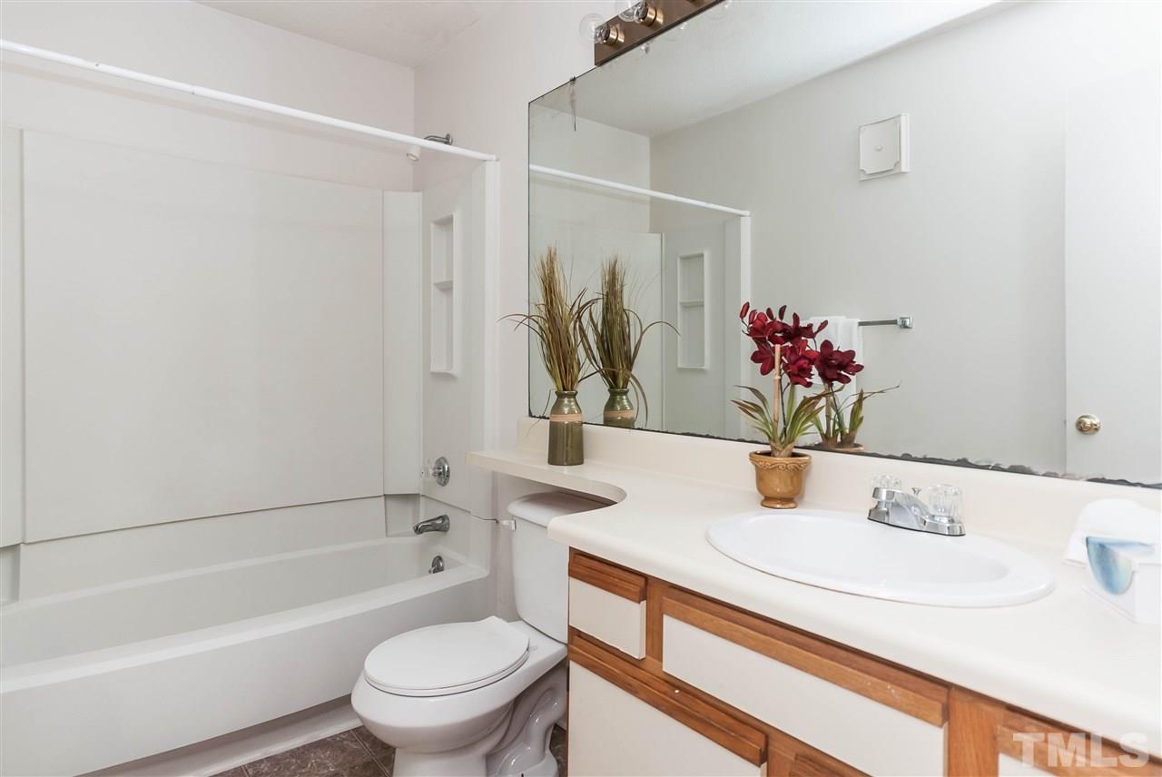 5808 Pointer Drive Raleigh, NC 27609 - Photo 14 of 19 a bathroom with a sink toilet and shower
