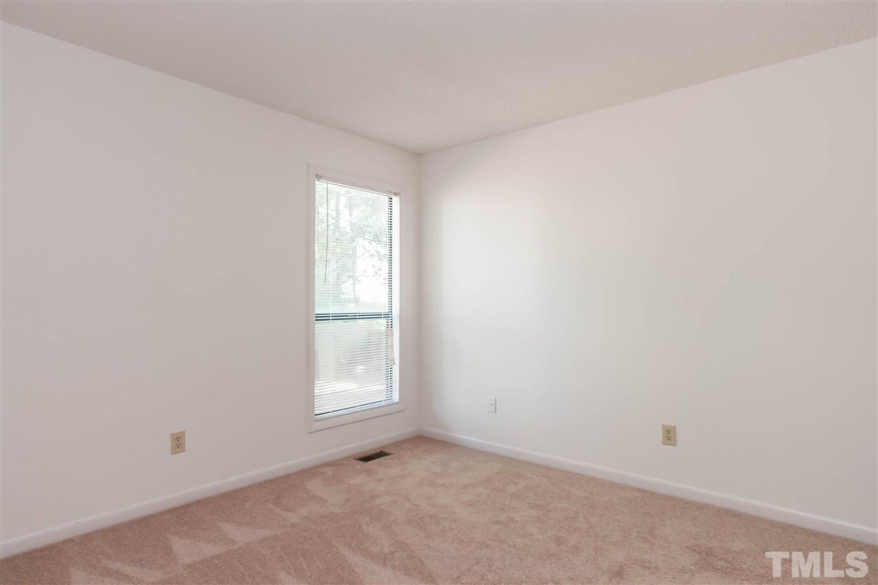 5808 Pointer Drive Raleigh, NC 27609 - Photo 16 of 19 an empty room with windows