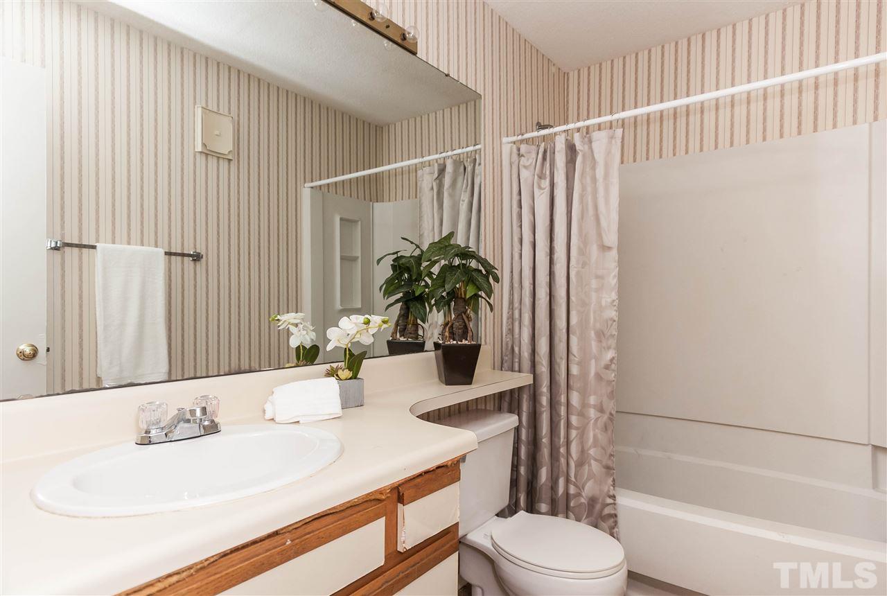 5808 Pointer Drive Raleigh, NC 27609 - Photo 17 of 19 a bathroom with a sink toilet and shower