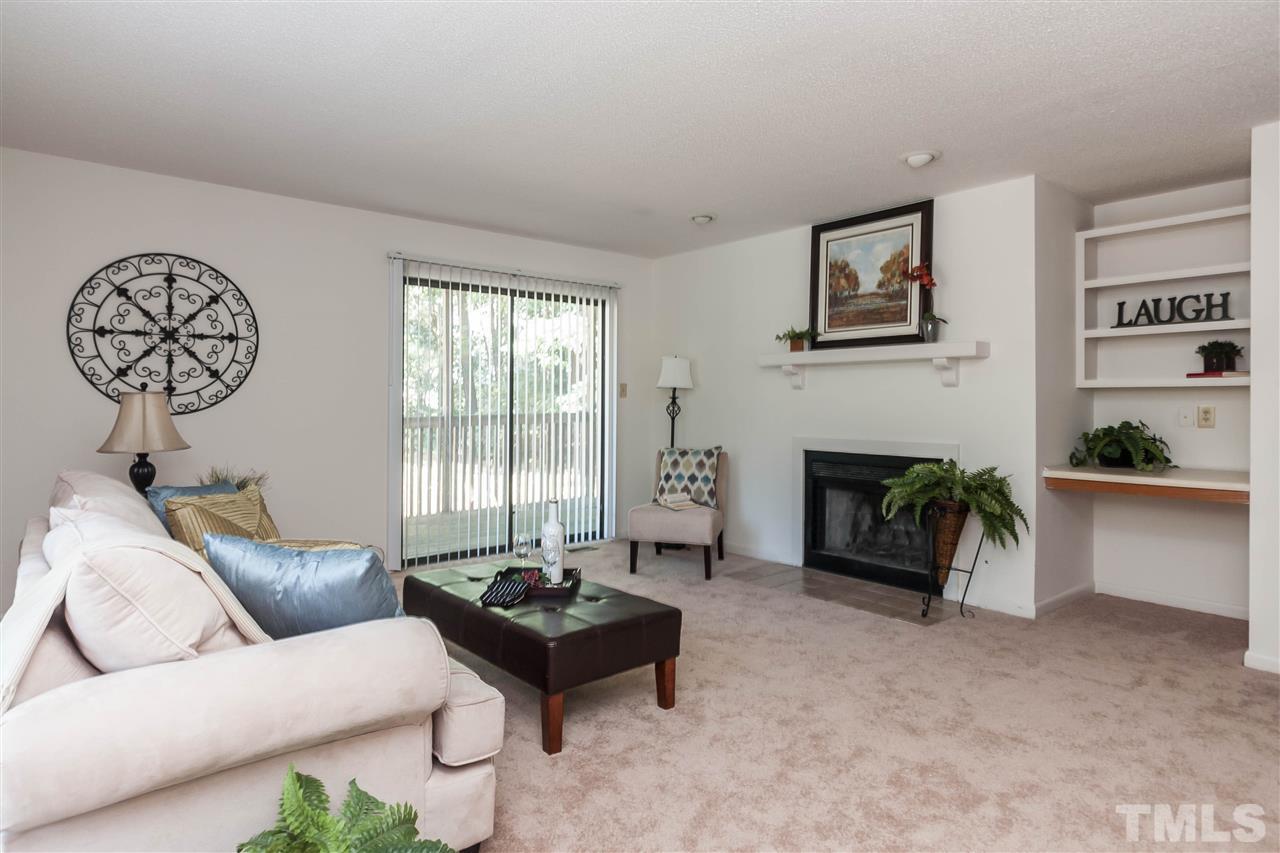 5808 Pointer Drive Raleigh, NC 27609 - Photo 3 of 19 a living room with furniture and a fireplace