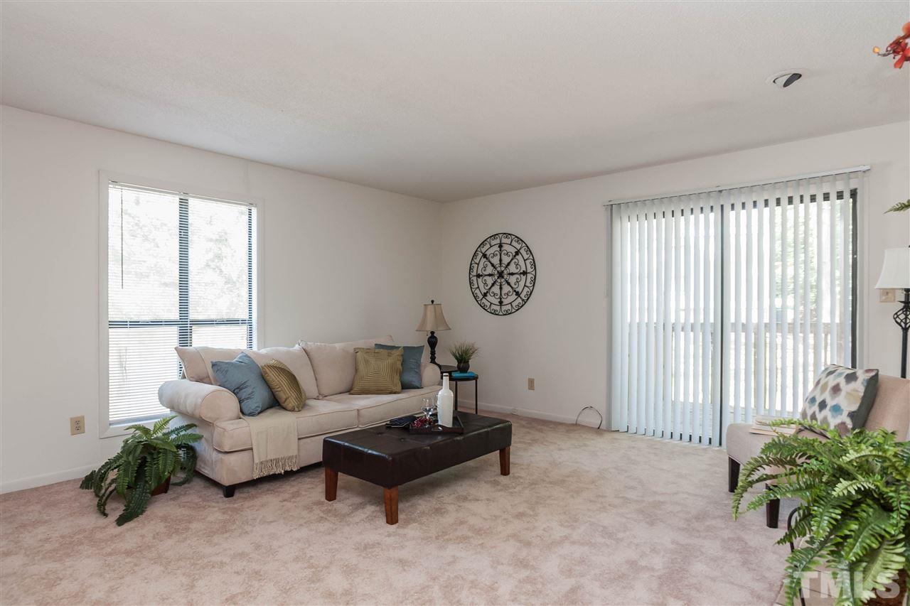 5808 Pointer Drive Raleigh, NC 27609 - Photo 5 of 19 a living room with furniture and a potted plant