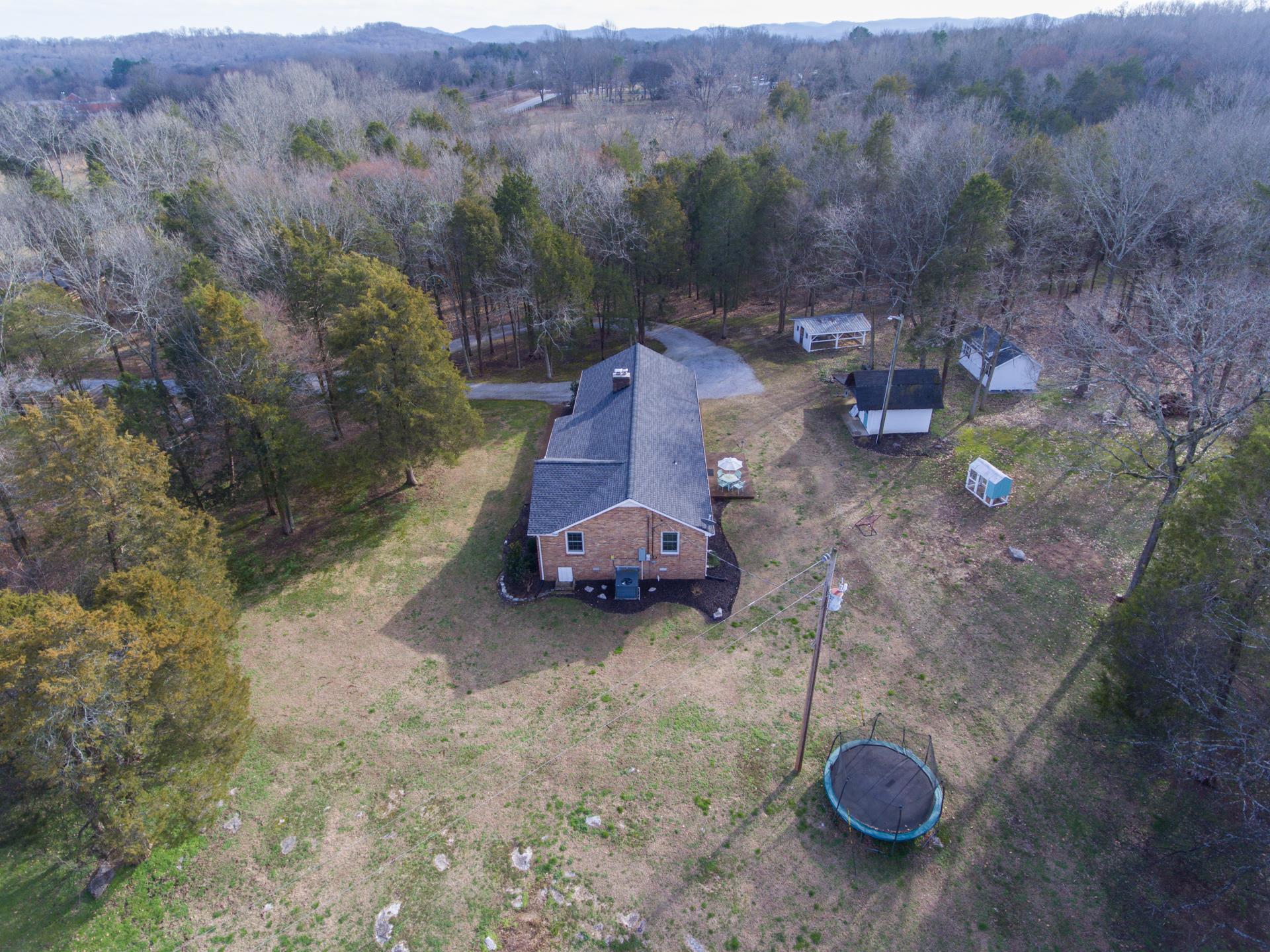 3637 North Chapel Road Franklin, TN 37067 - Photo 28 of 30 a view of a backyard with table and chairs