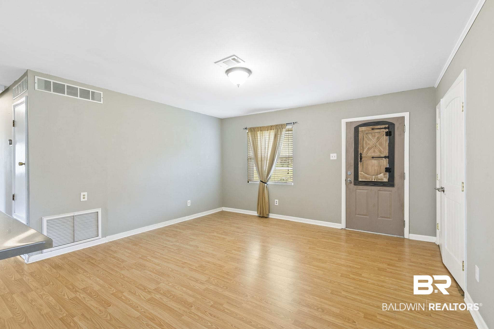 13108 6th Street Lillian, AL 36549 - Photo 7 of 39 Unfurnished room featuring light wood-type flooring