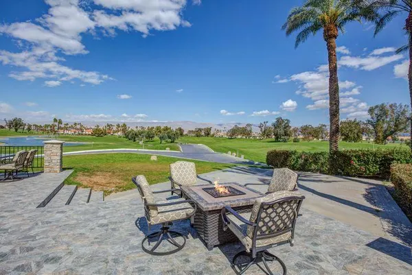 a view of a house and a big yard