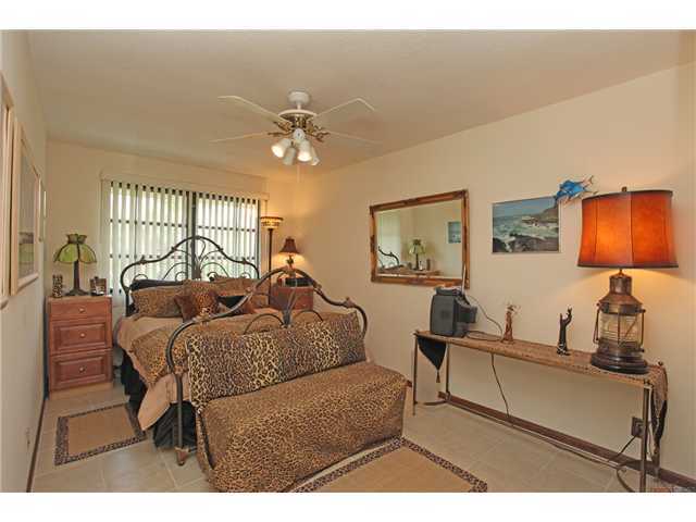 169 Southeast Wavecrest Way Boca Raton, FL 33432 - Photo 13 of 25 a living room with furniture a lamp and a large window