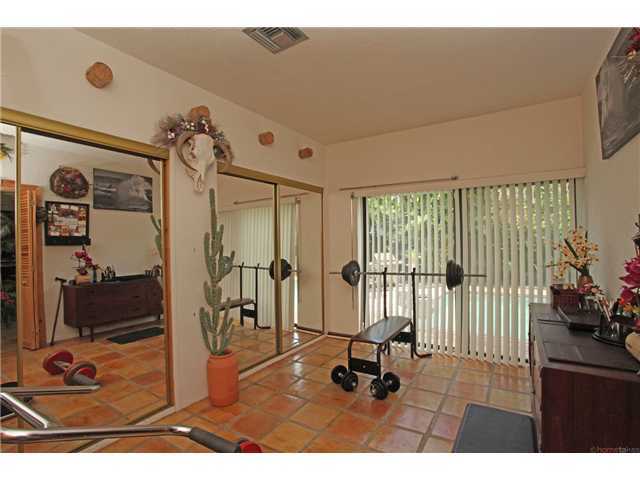 169 Southeast Wavecrest Way Boca Raton, FL 33432 - Photo 15 of 25 a view of a livingroom with gym equipment