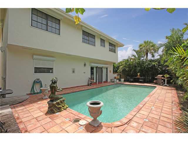 169 Southeast Wavecrest Way Boca Raton, FL 33432 - Photo 3 of 25 a front view of house with yard