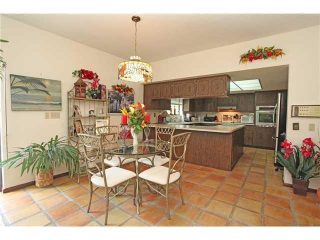 169 Southeast Wavecrest Way Boca Raton, FL 33432 - Photo 8 of 25 a dining room filled with furniture and kitchen view